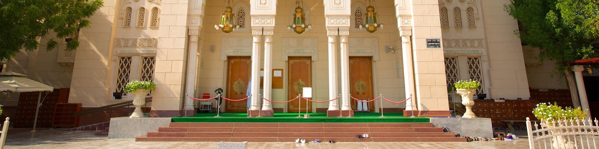 A large, ornate building with multiple domes and arches.