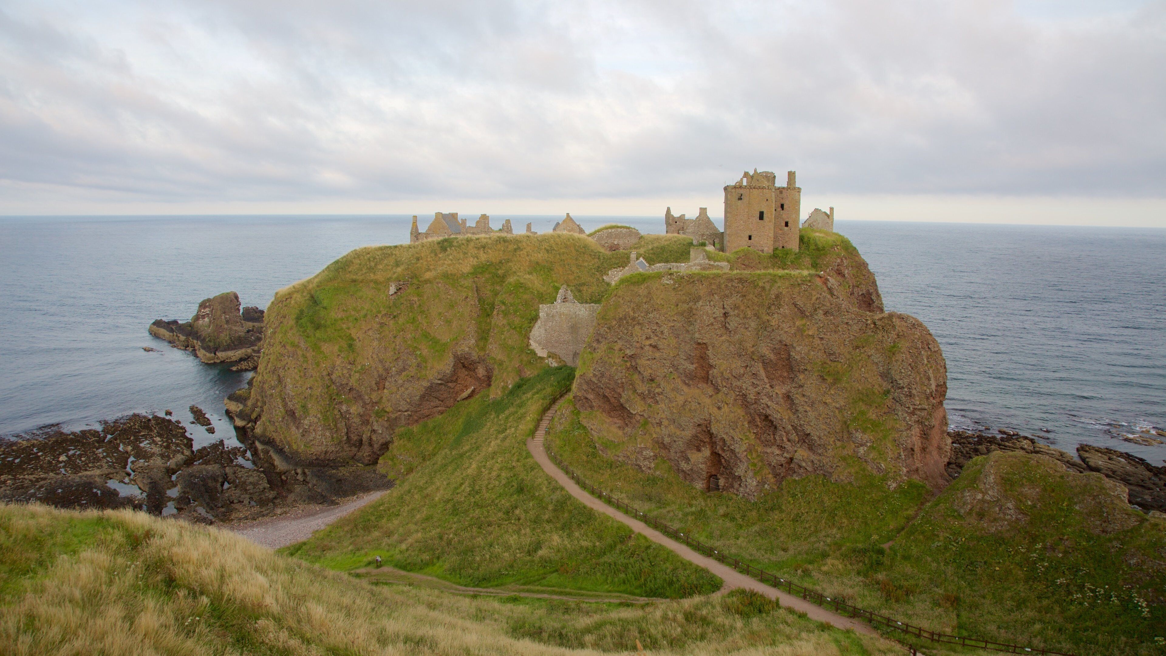 Dunnottar Castle showing a castle, general coastal views and farmland