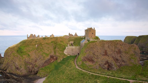 Dunnottar Castle featuring a castle, farmland and general coastal views