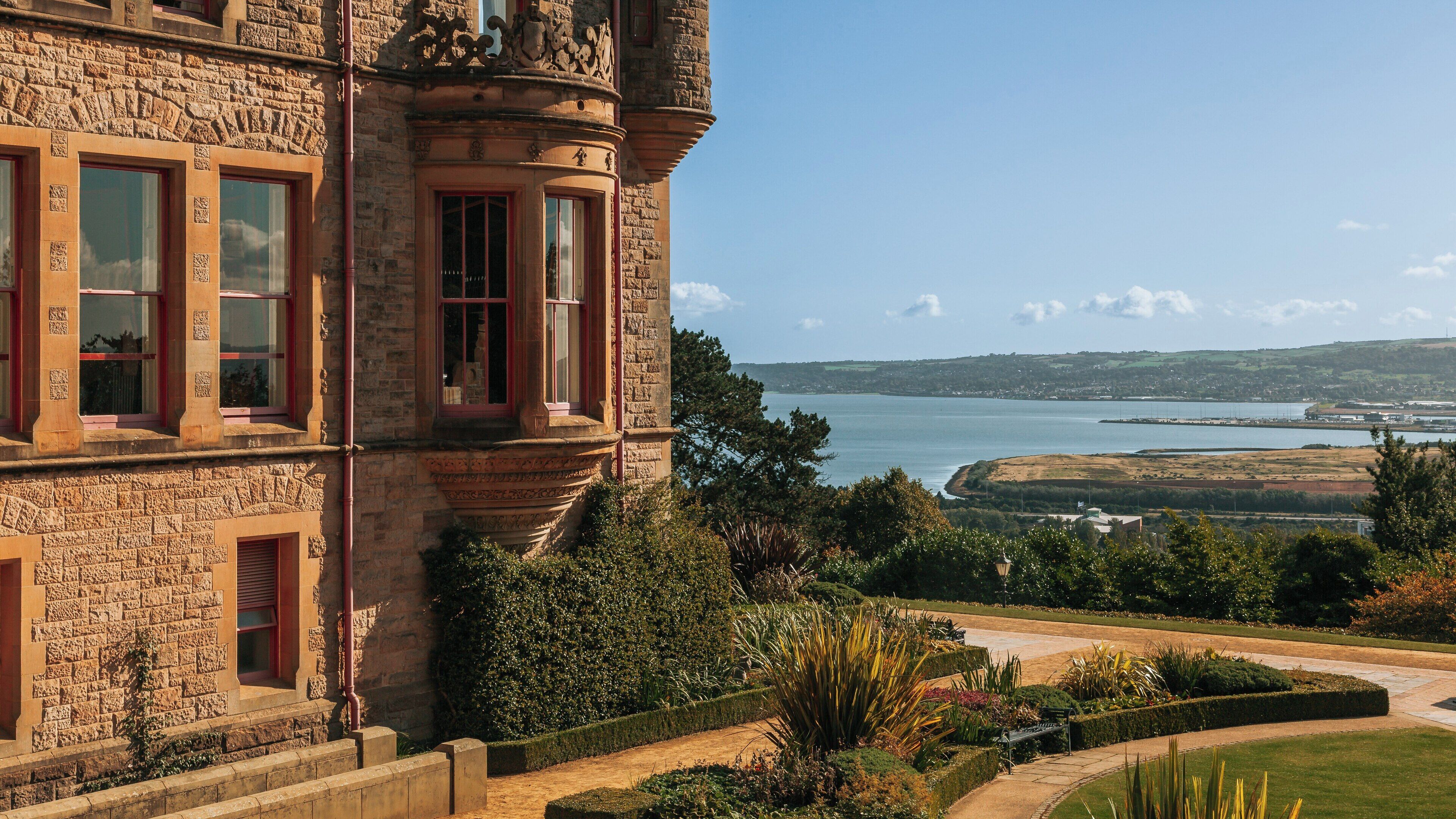 Belfast Castle overlooks stunning views of the surrounding landscape, showcasing Northern Ireland's natural beauty and architectural charm