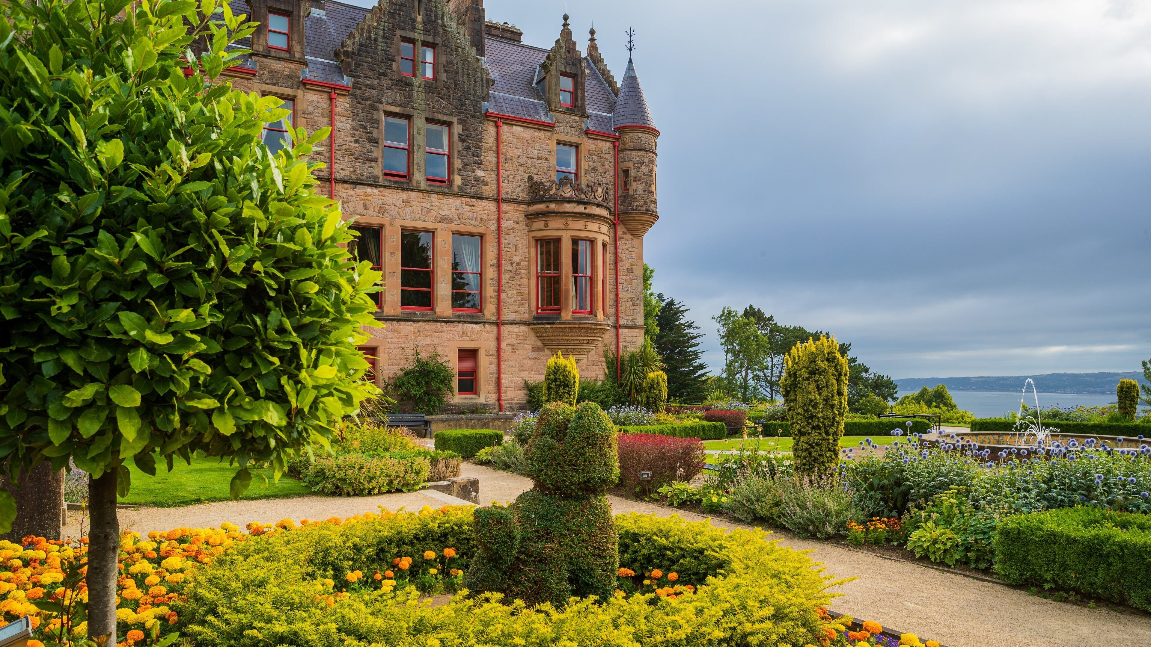 Belfast Castle which includes heritage architecture, wildflowers and a park