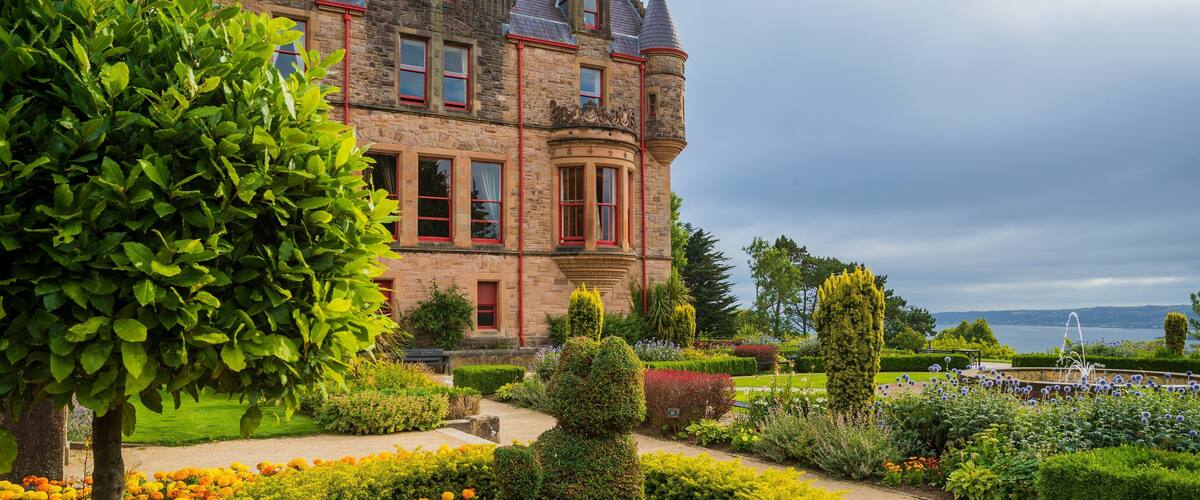 Belfast Castle which includes heritage architecture, wildflowers and a park
