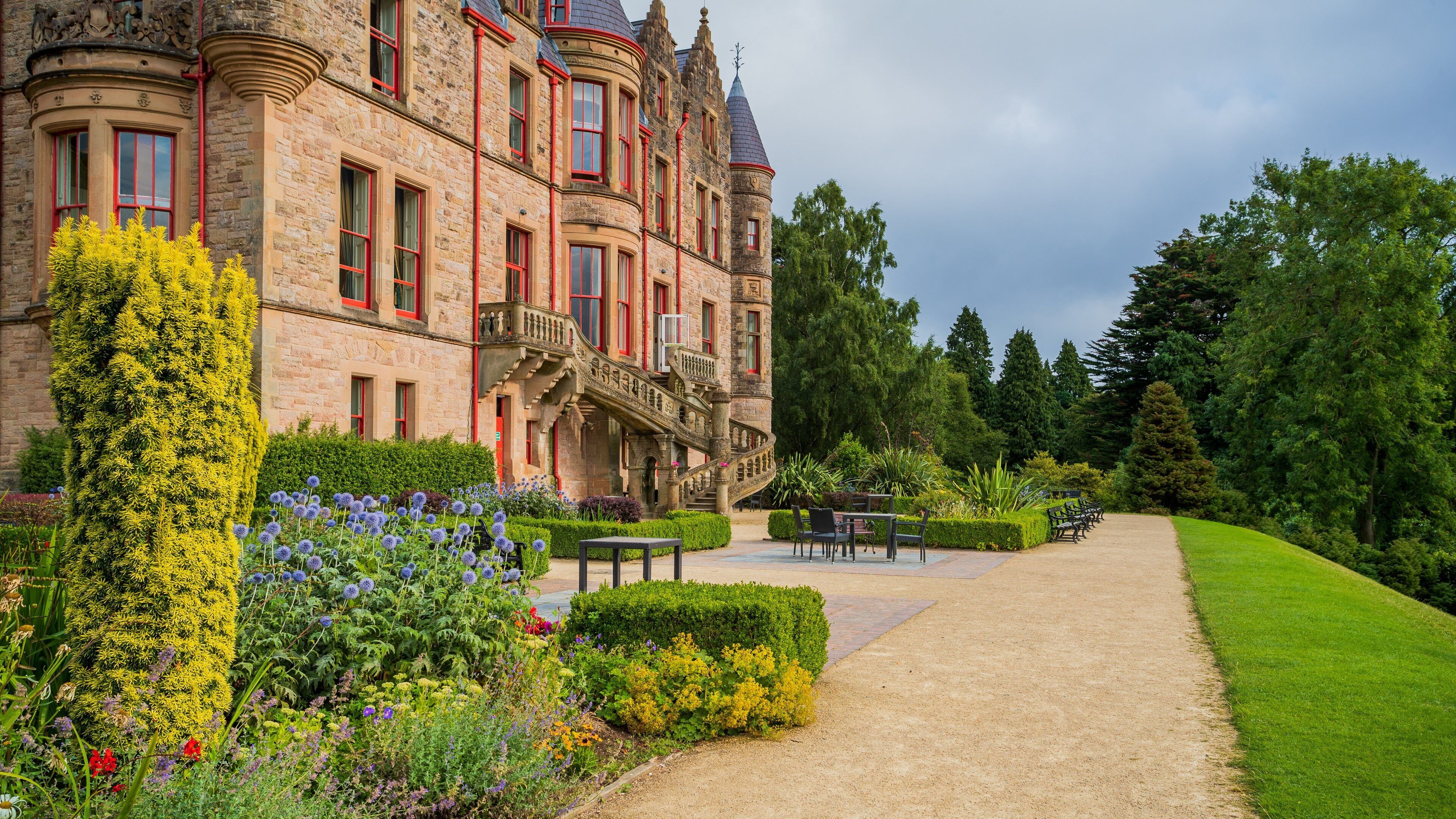 Belfast Castle showing heritage architecture, wildflowers and chateau or palace