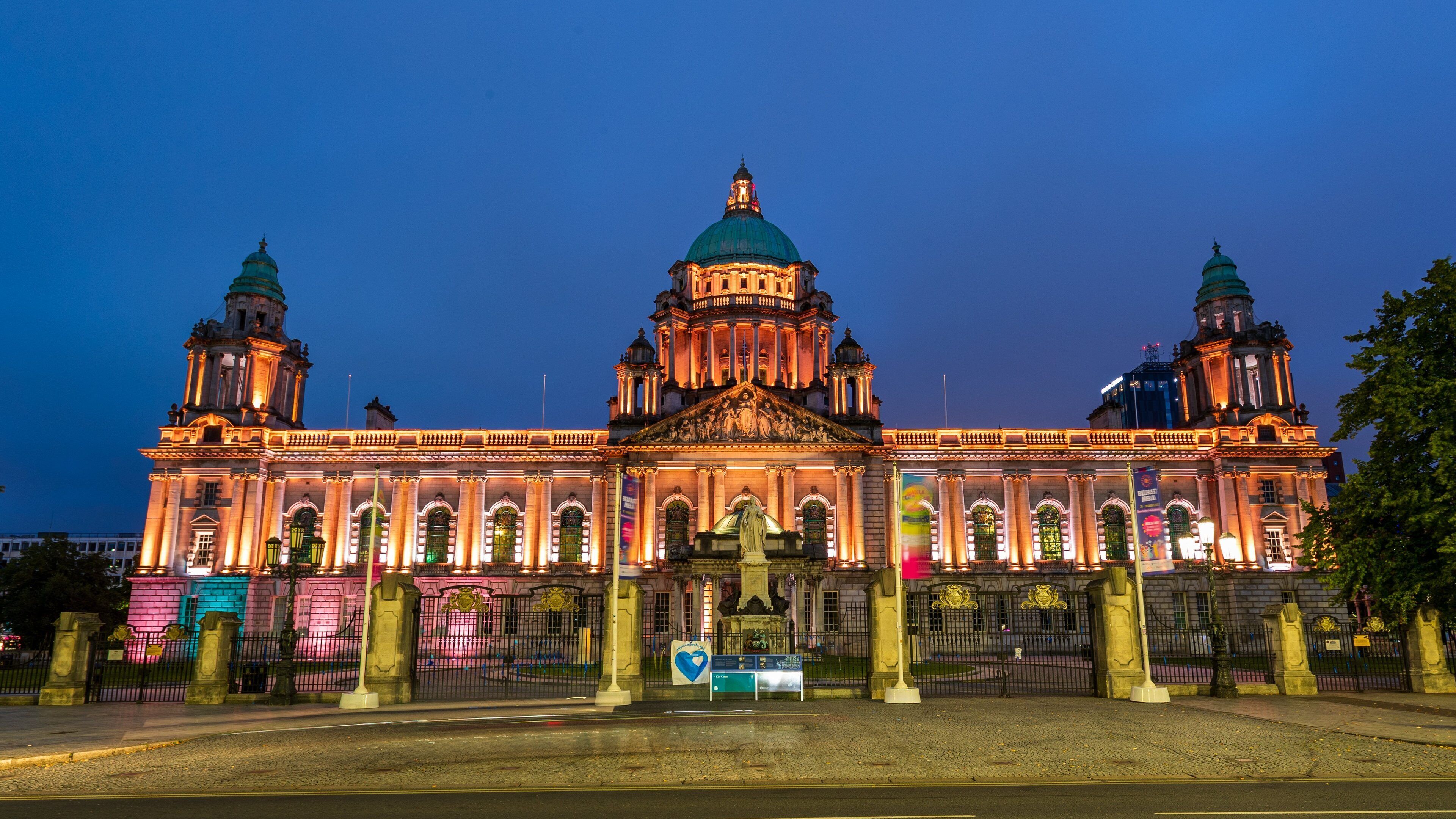 Belfast City Hall showing heritage architecture, night scenes and an administrative buidling