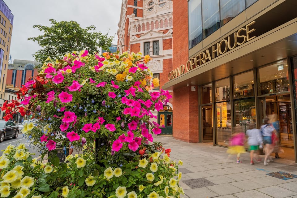A flower display in front of the Grand Opera House.
