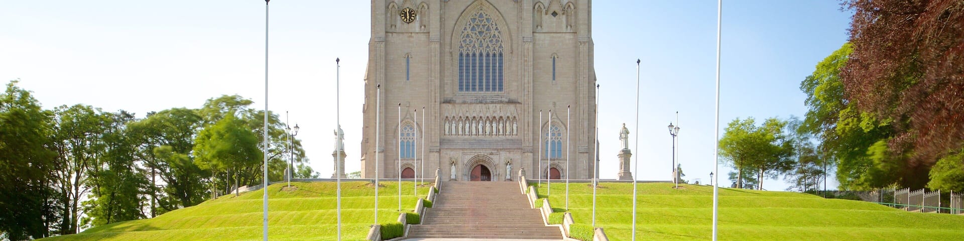 A large cathedral with two tall spires and a central rose window.