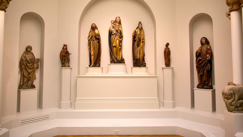 A collection of religious statues in a museum setting.