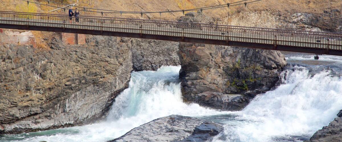 Riverfront Park featuring a river or creek, rapids and a bridge