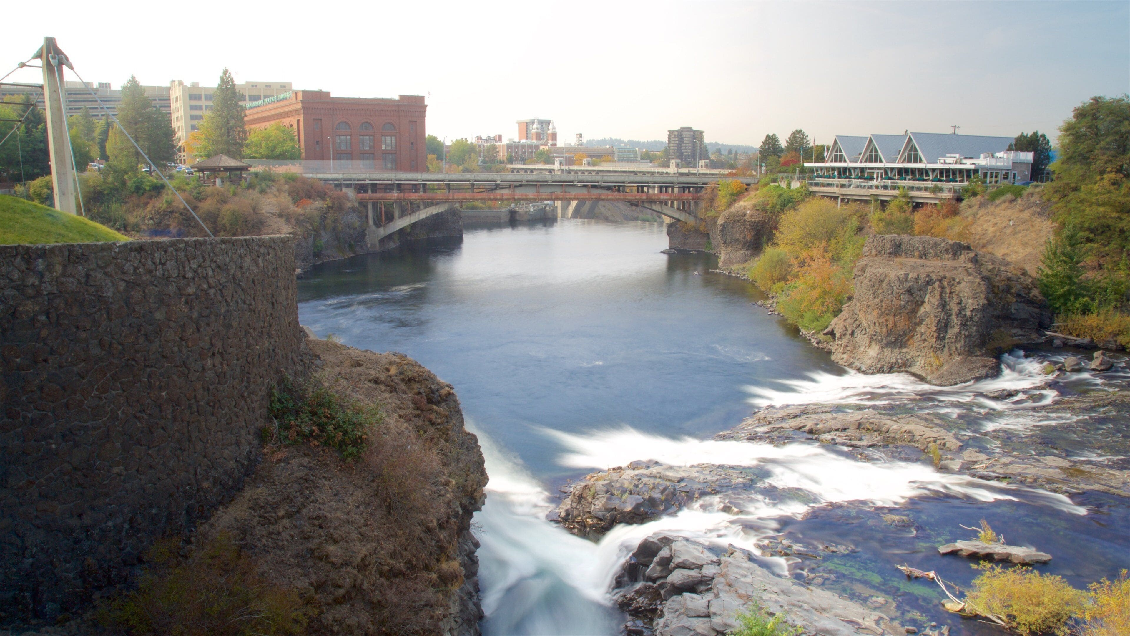 Riverfront Park showing a bridge, heritage architecture and a river or creek