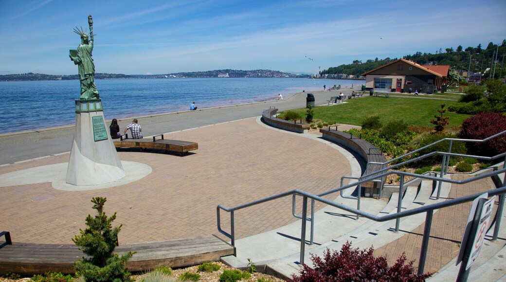 Visit Alki Beach in Seattle for stunning views and relaxing atmosphere by the waterfront on a beautiful sunny day