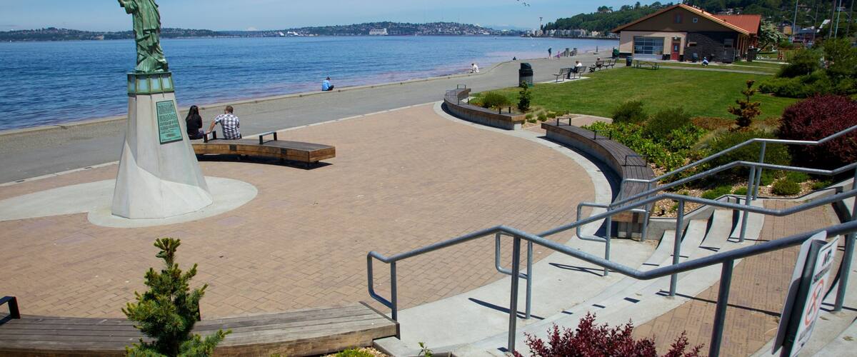 Alki Beach which includes a memorial, a monument and a square or plaza