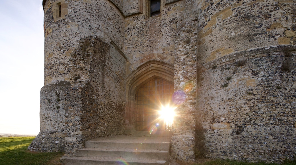 Donnington Castle which includes building ruins, a sunset and heritage elements