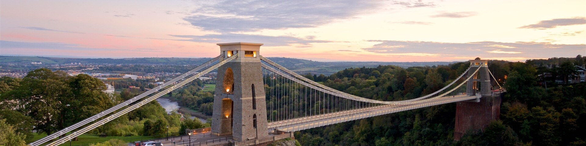 Clifton Suspension Bridge featuring landscape views, a river or creek and a sunset