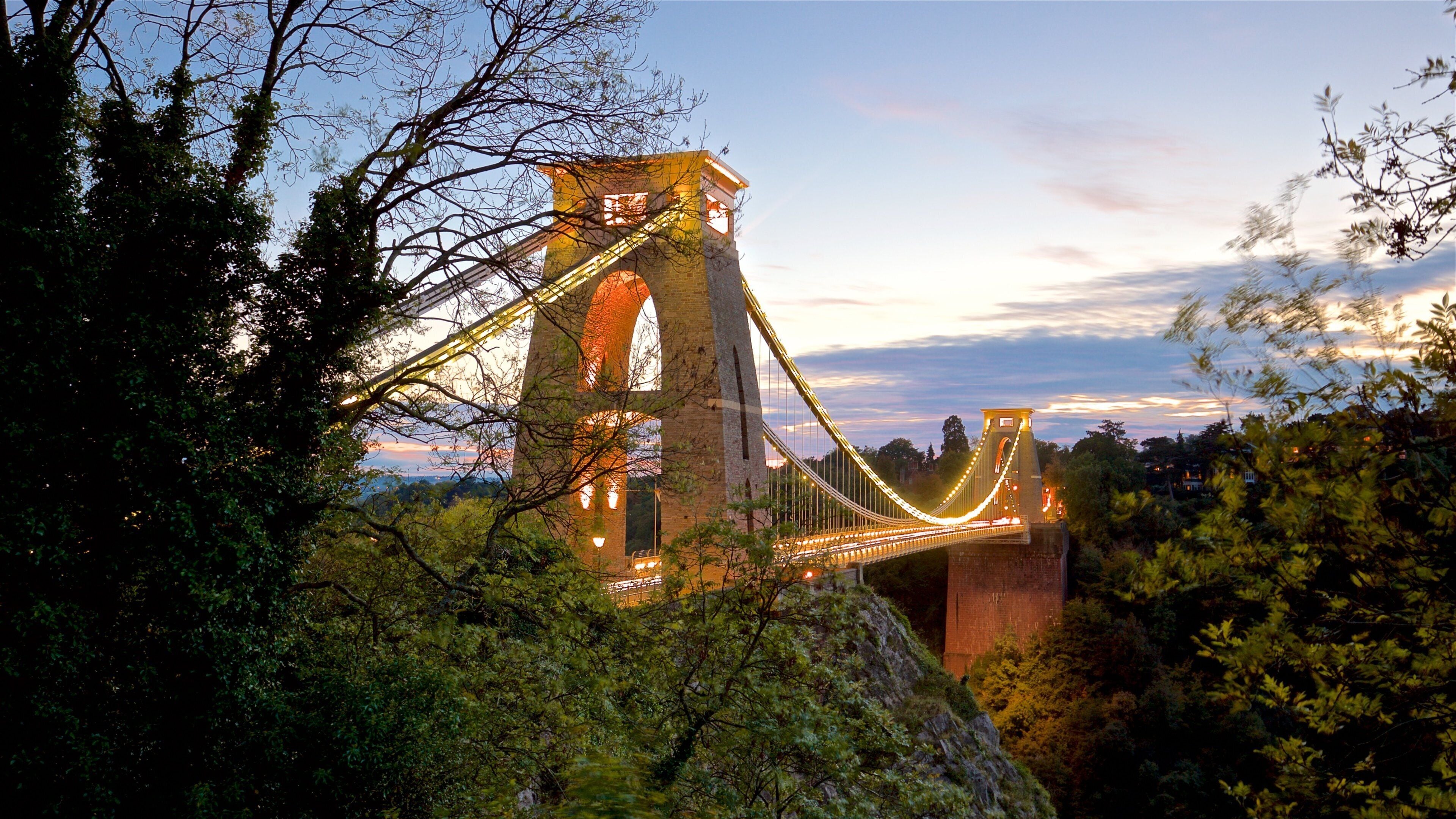 Clifton Suspension Bridge featuring a sunset, a bridge and landscape views