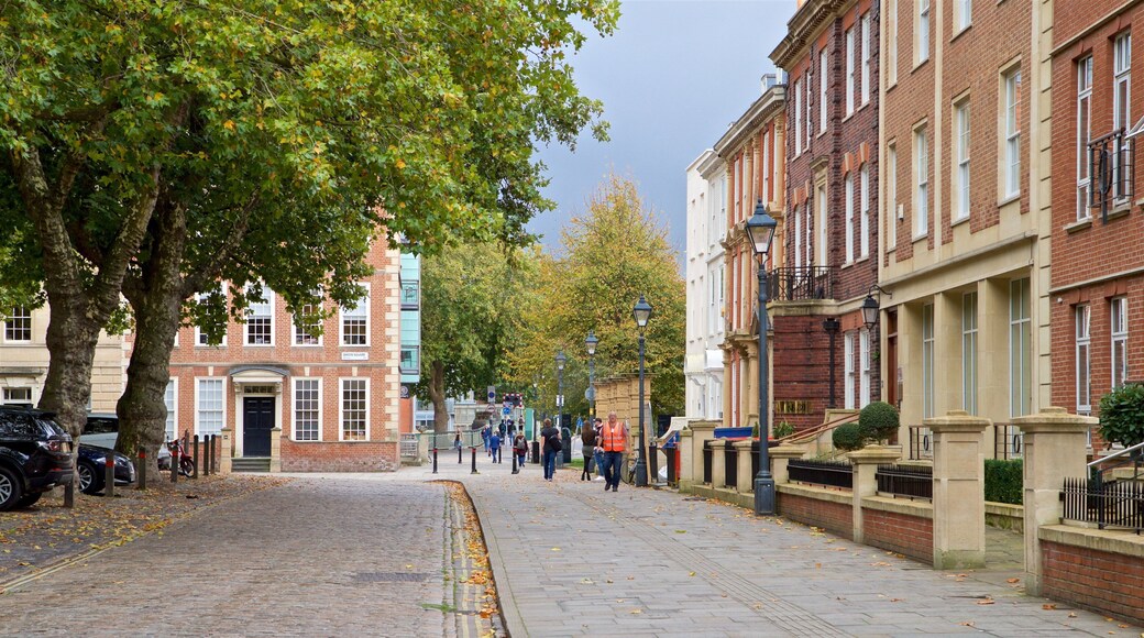 Queen Square which includes street scenes as well as a small group of people