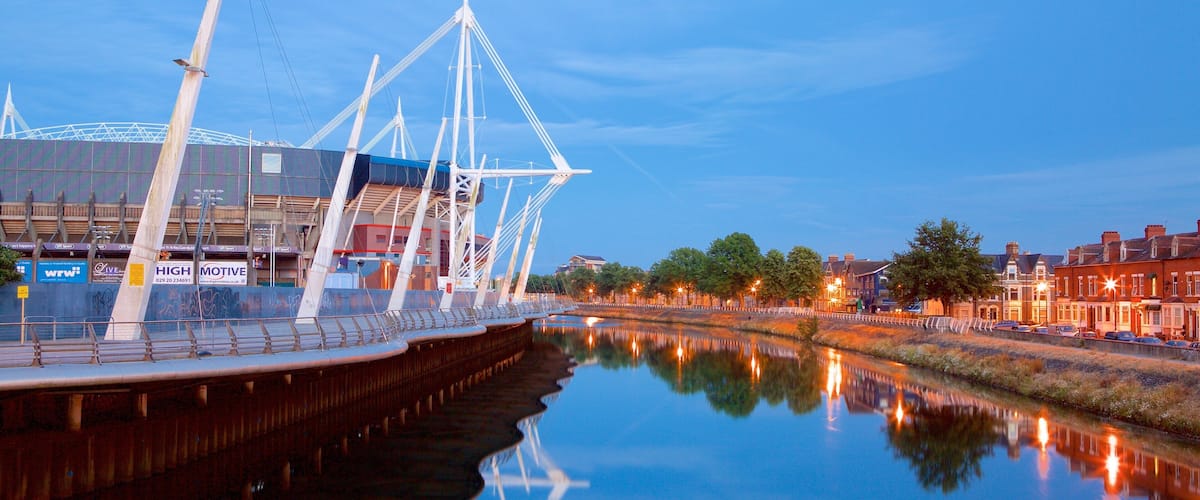 Principality Stadium showing modern architecture and a river or creek