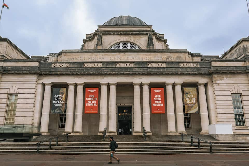 A large, historic building with a prominent dome and columns.
