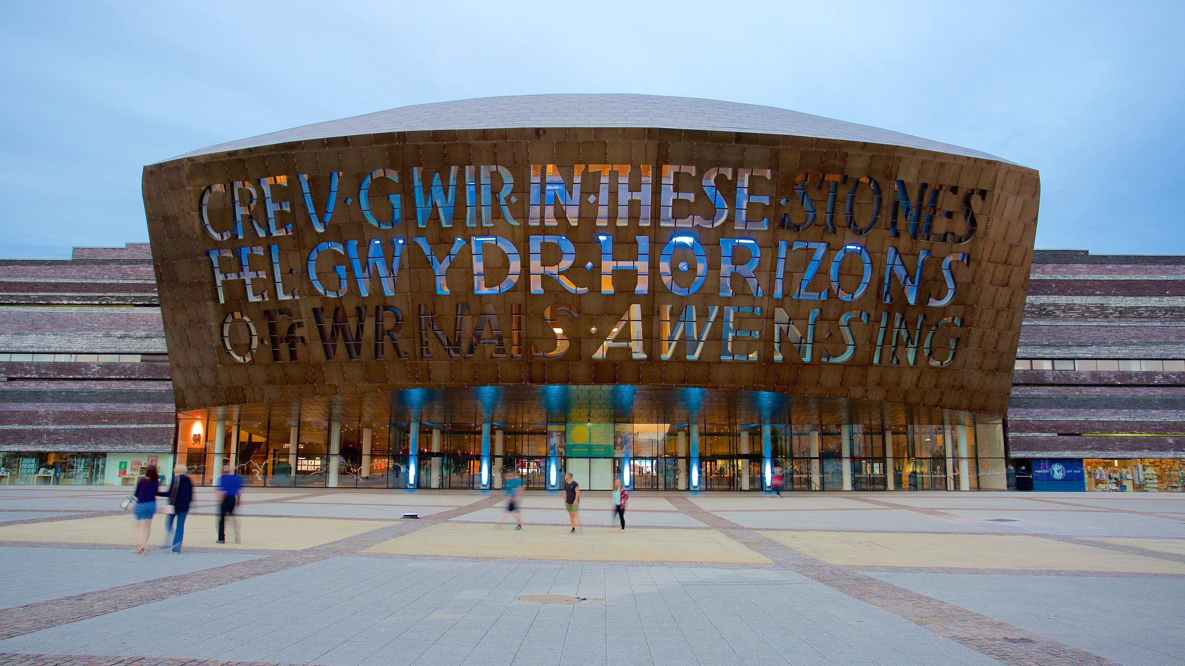 Wales Millennium Centre which includes a square or plaza, signage and modern architecture