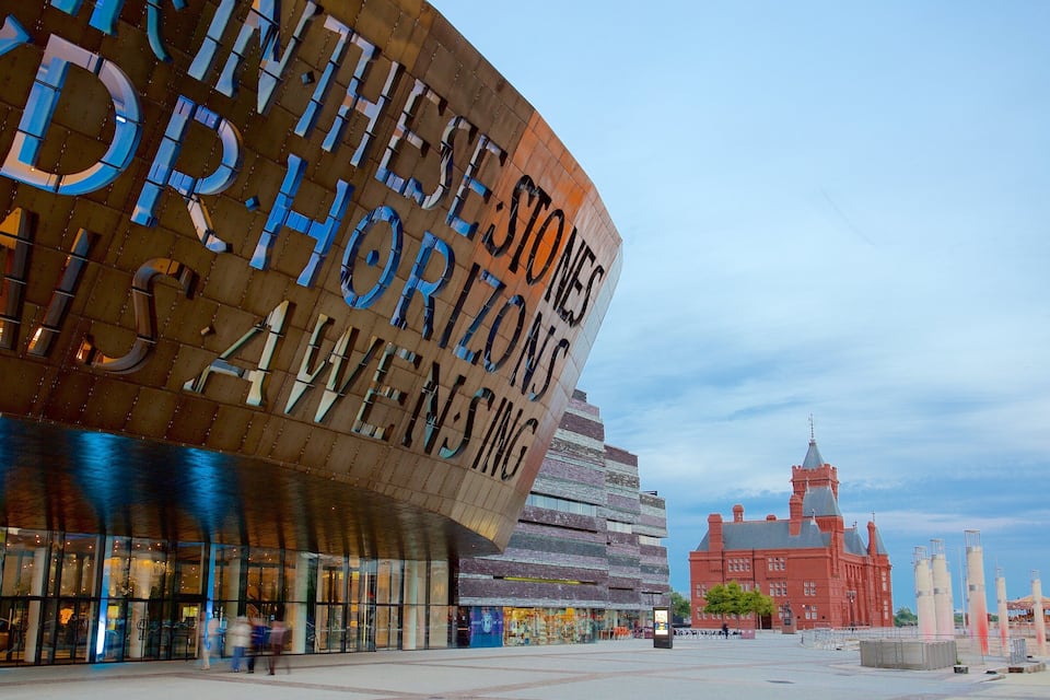 A modern building with large letters spelling "HORIZONS" and "ALIVE".