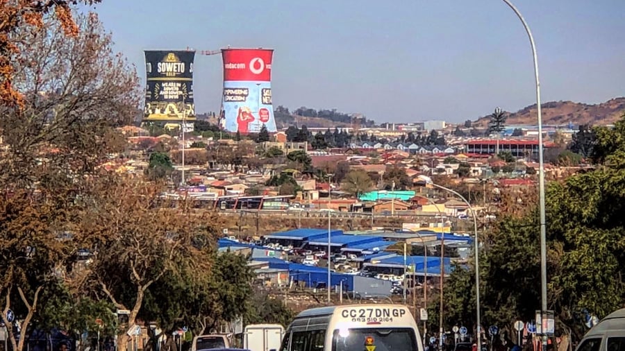 A view of the Soweto Towers from the Hector Pieterson Memorial. The towers were recently painted with advertisements, against many in the community’s wishes.
