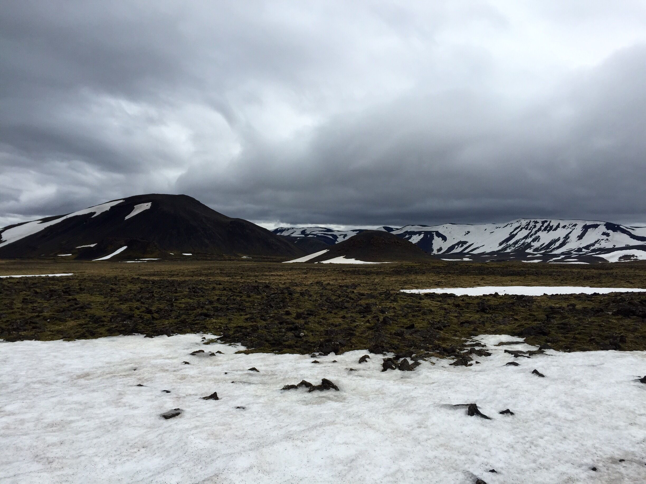 This is the view you get along the hike to go INSIDE a volcano. Such beautiful scenery made for a very enjoyable hike!
I was questioning weather or not this would be awesome or more hype/cool in theory... But after doing it it was easily my favorite tour from my trip in Iceland and the most incredible experience!!! Words simply can describe the beauty and energy of going inside a volcano. It's about a 45min hike (#hike) over lava fields and some patches of snow in my case to get to "base camp".  (Or you can take a helicopter up, but honestly the hike is pretty awesome). There you get put into smaller groups that take turns going inside. You get plenty of time inadequate (about 45min), and the guides are super knowledgeable! I learned so much! Not to mention the ones we had we extremely friendly and funny too. This was such an enjoyable tour. Do not hesitate to book this!! Especially since they may be closing it soon (and it's only been open for 4 years, so quite the rare unique truly one in a life time experience). 