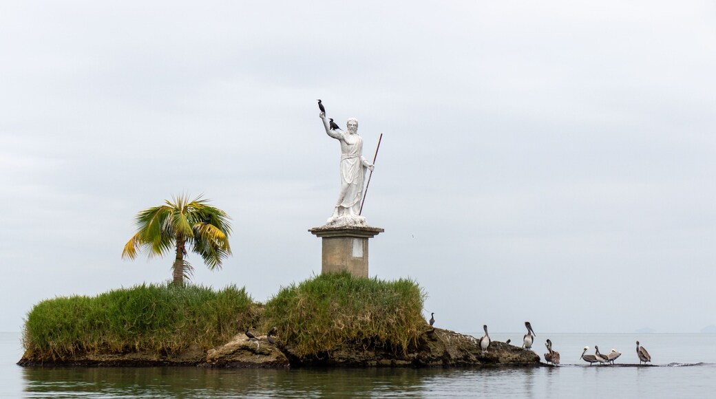 Statue of the god of the sea with pelicans on it in Livingston, Guatemala