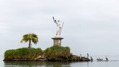 Statue of the god of the sea with pelicans on it in Livingston, Guatemala