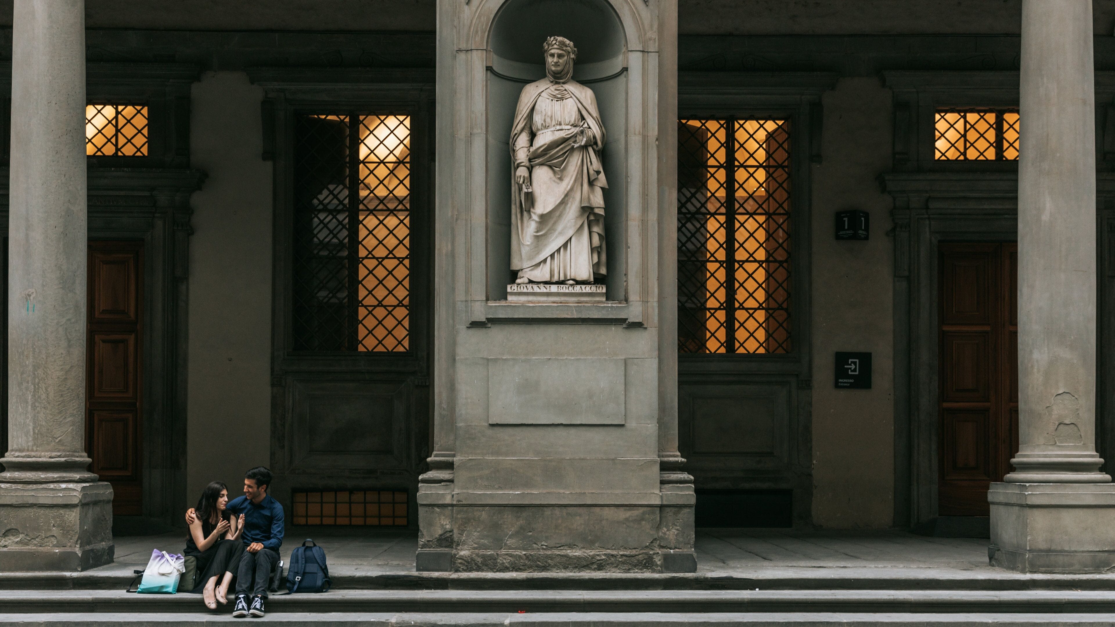 Duomo featuring heritage elements and a statue or sculpture as well as a couple