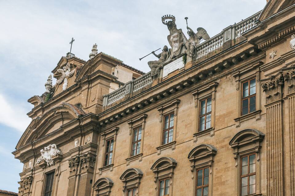 A historic building with ornate sculptures and classical architecture.