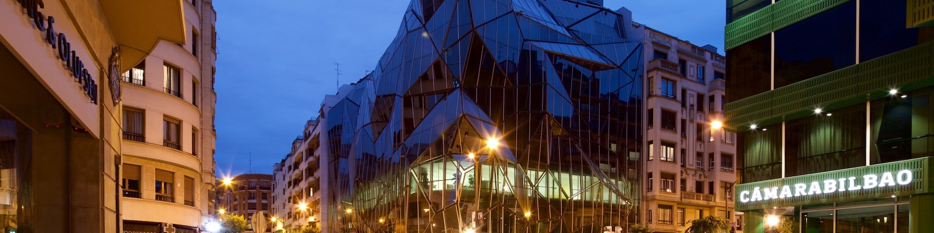 Bilbao which includes modern architecture, night scenes and a city