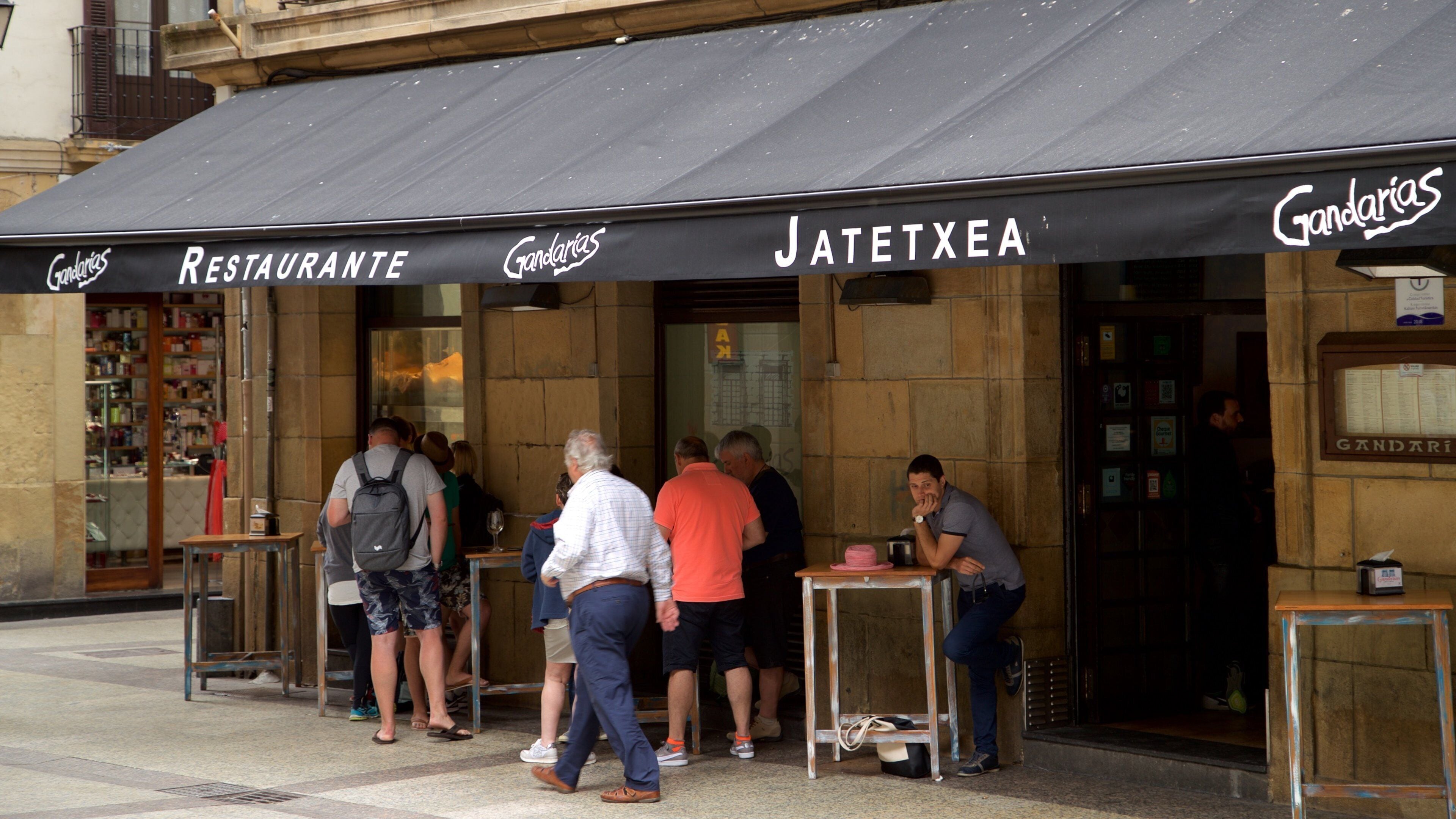 San Sebastian which includes a bar and street scenes as well as a small group of people