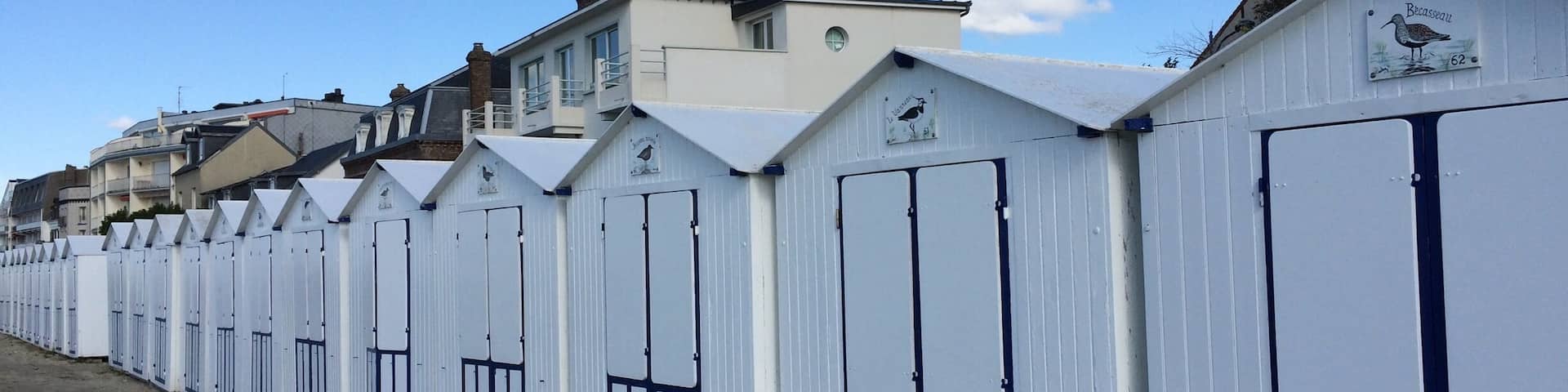 Beach huts along the beach promenade.