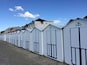 Beach huts along the beach promenade.
