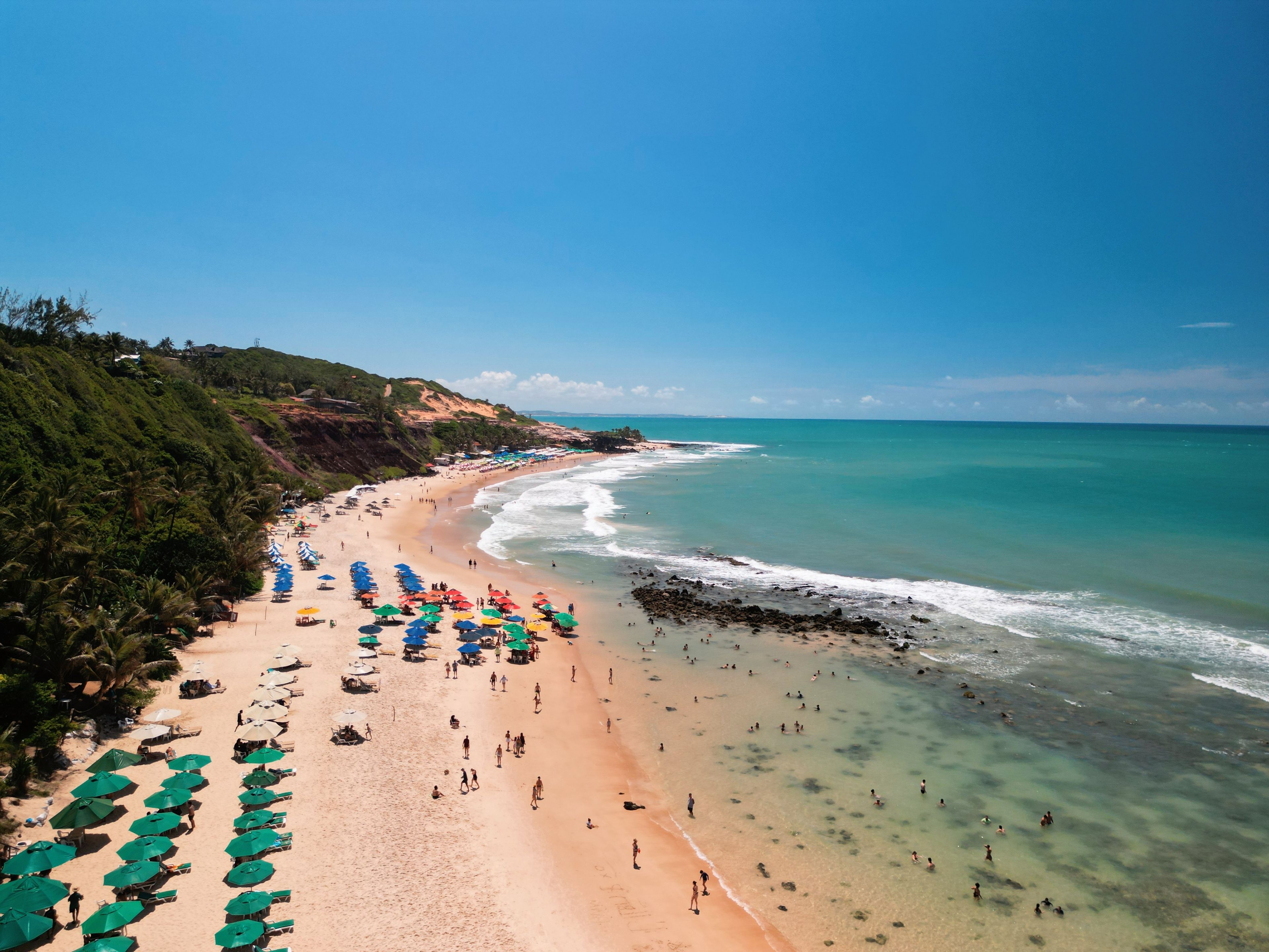 Aerial view of Praia da Pipa and Chapadão cliffs in Pipa, Rio Grande do Norte, Brazil, showing paradise beaches, blue sea, and dramatic coastline – perfect summer destination