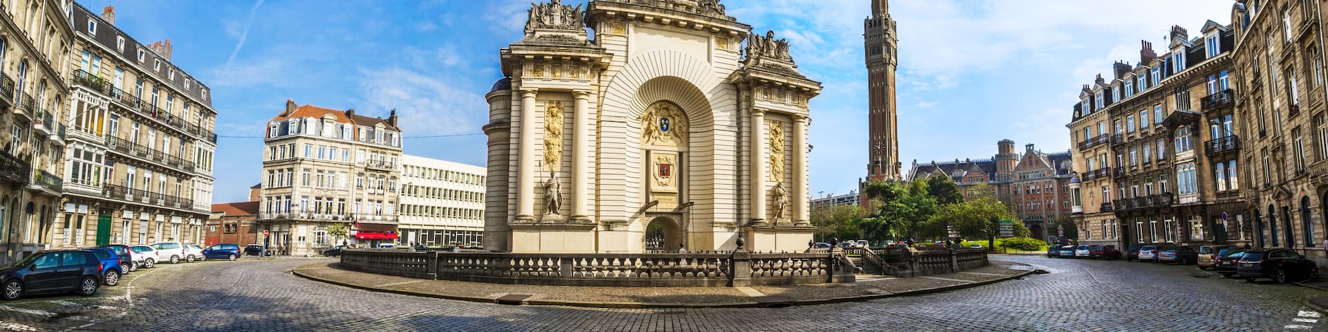 View of french city Lille with belfry, council hall and Paris’ gate