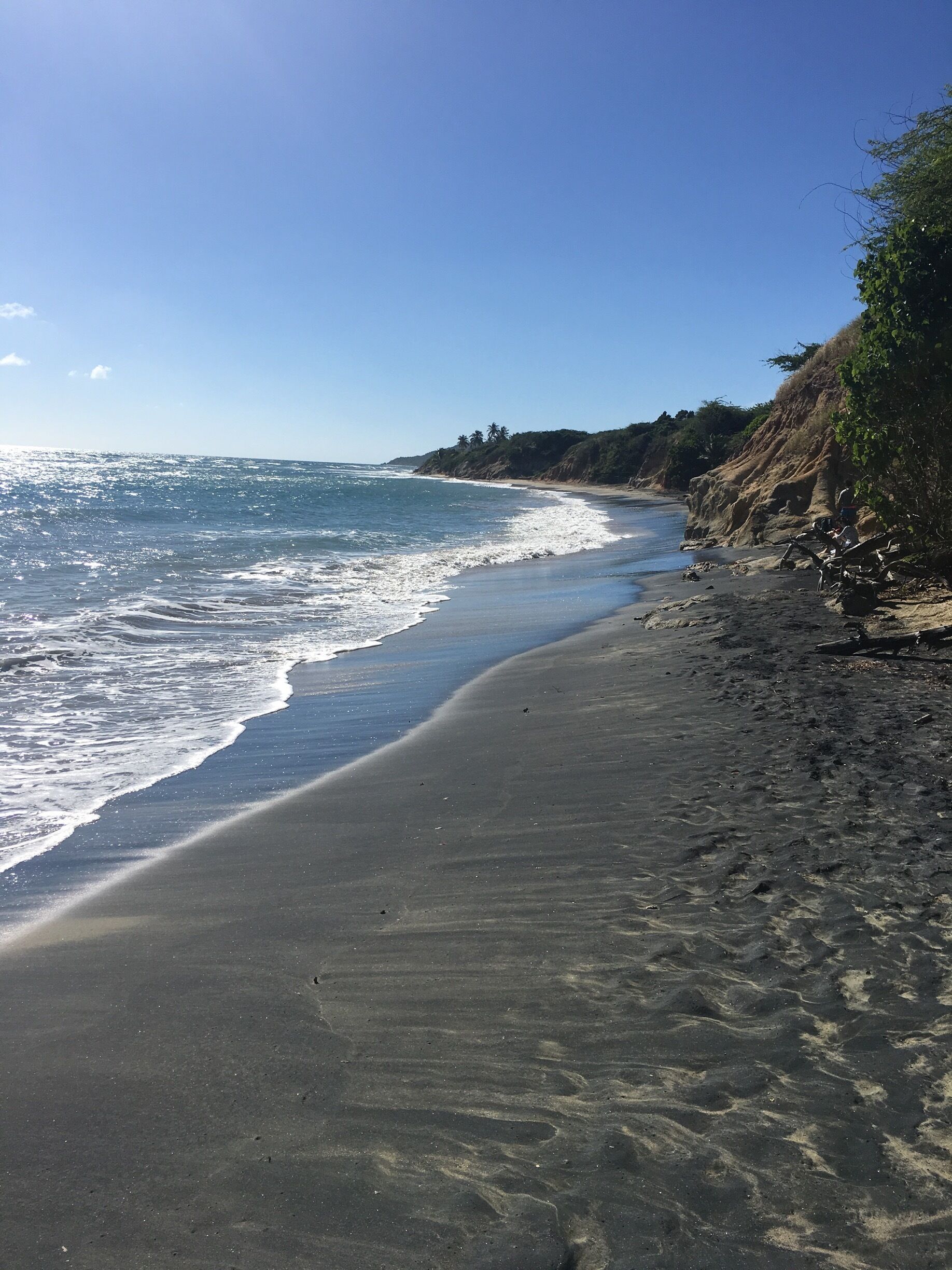 A beautiful beach with black sand 