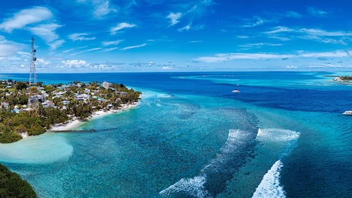 Thulusdhoo Island amidst blue sea at Kaafu atoll, Maldives