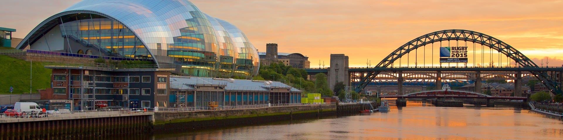 Newcastle-upon-Tyne featuring modern architecture, a bridge and a sunset