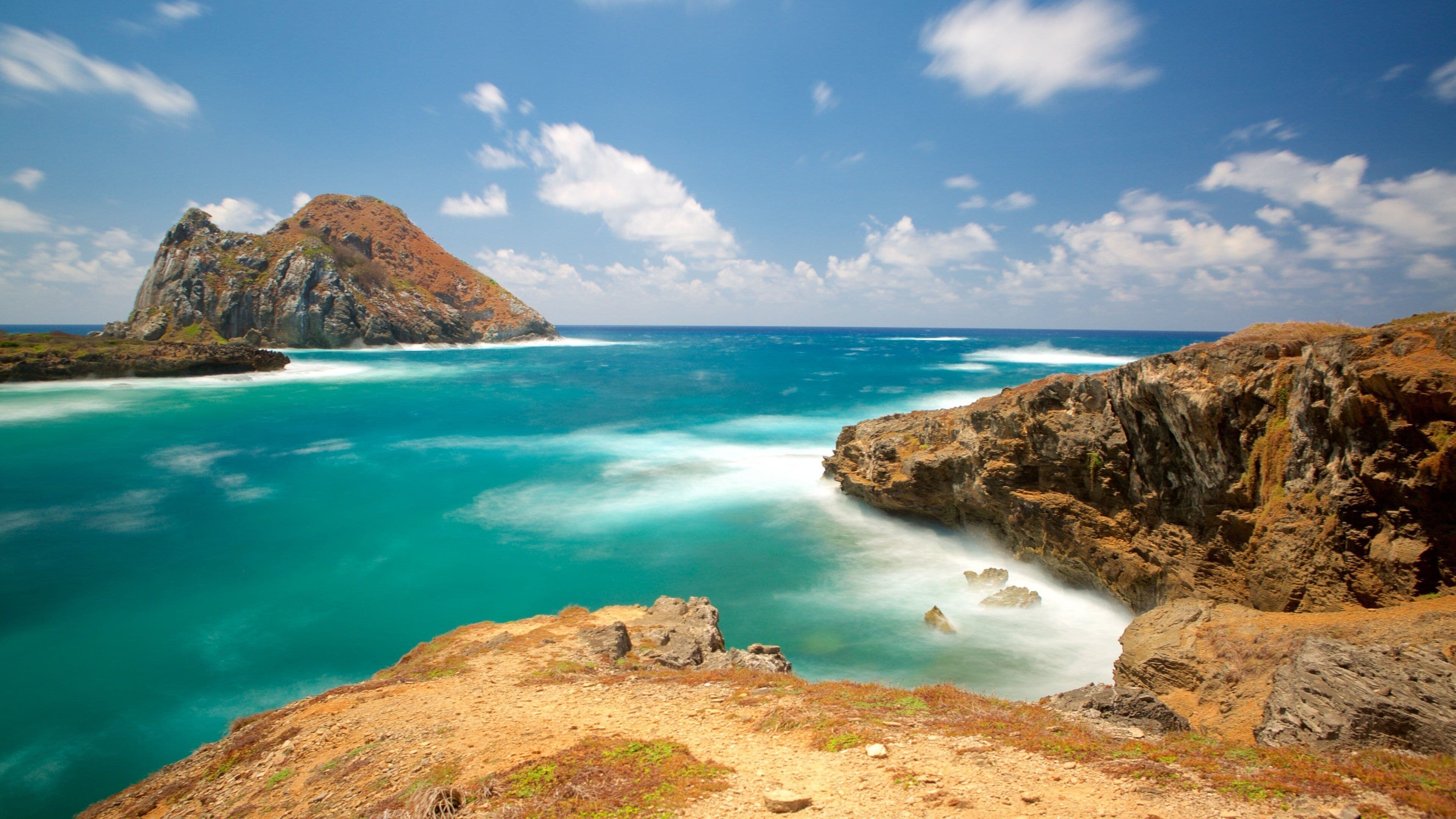Fernando de Noronha which includes landscape views and rugged coastline