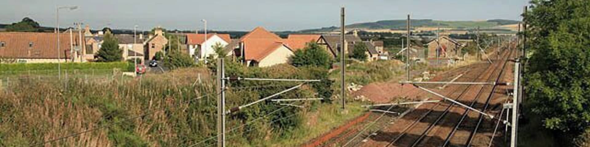 The East Coast Line Railway line viewed from a bridge in Reston.