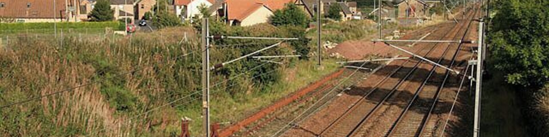 The East Coast Line Railway line viewed from a bridge in Reston.