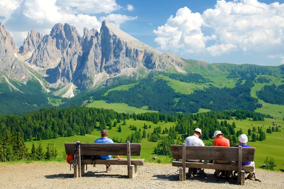 A mountainous landscape with rocky peaks and green valleys.
