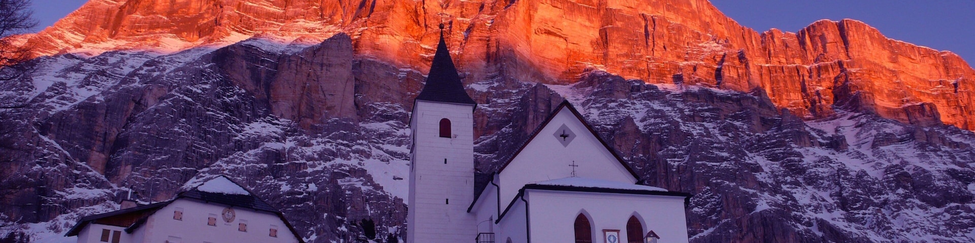 Alta Badia showing mountains, a church or cathedral and snow