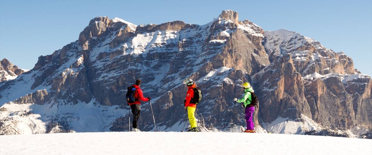 Alta Badia showing snow and mountains as well as a small group of people