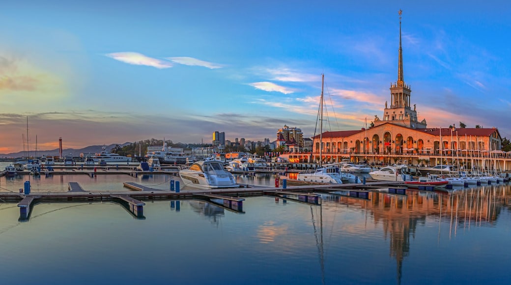 SOCHI, RUSSIA - APRIL 26, 2015: Panorama with sunset - boats and yachts on the quay in the seaport