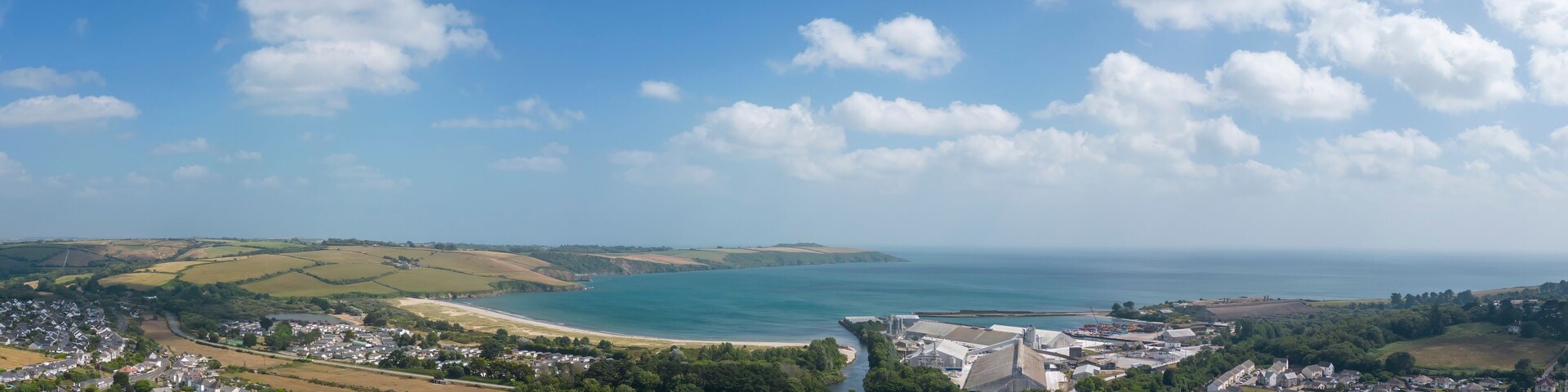An aerial view looking across the town of Par towards the beach in Cornwall, UK