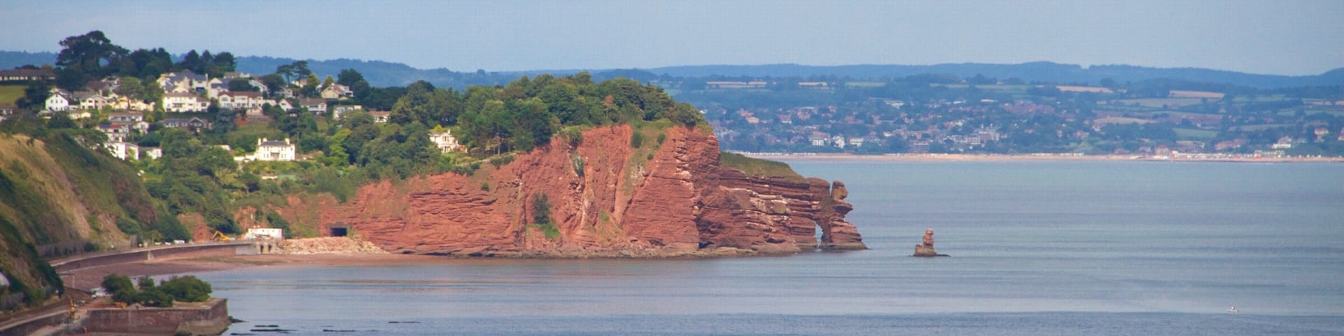 Teignmouth featuring a coastal town, a beach and general coastal views