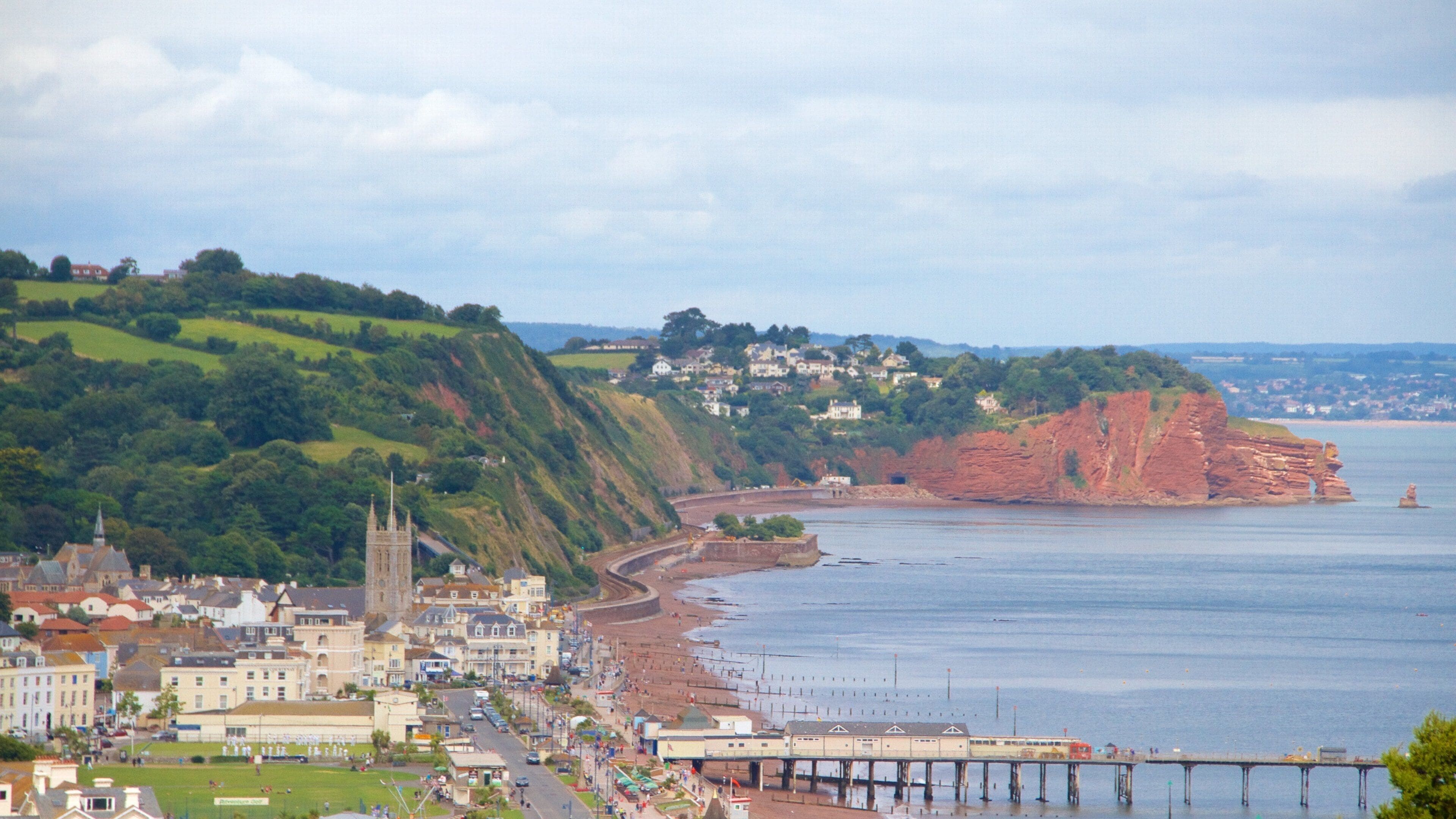 Teignmouth showing a bridge, a beach and general coastal views