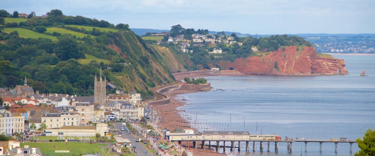 Teignmouth showing a bridge, a beach and general coastal views