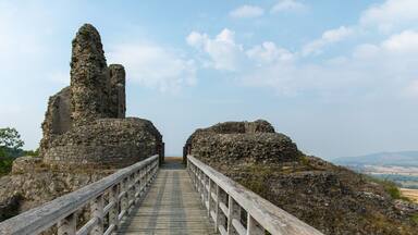 View of Montgomery Castle and bridge in mid-Wales in UK against a blue sunny sky